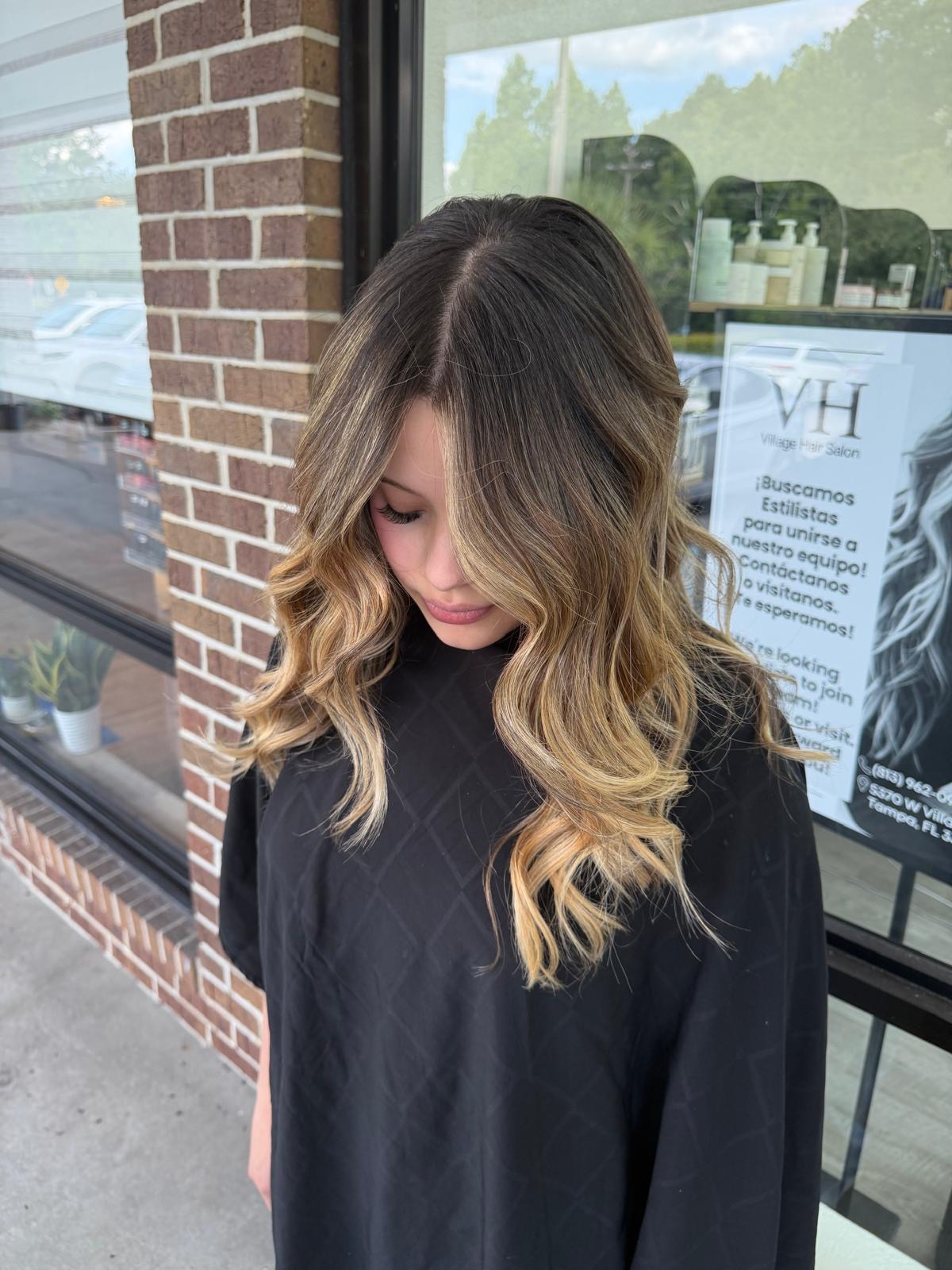 Warm balayage transformation outside Village Hair Salon