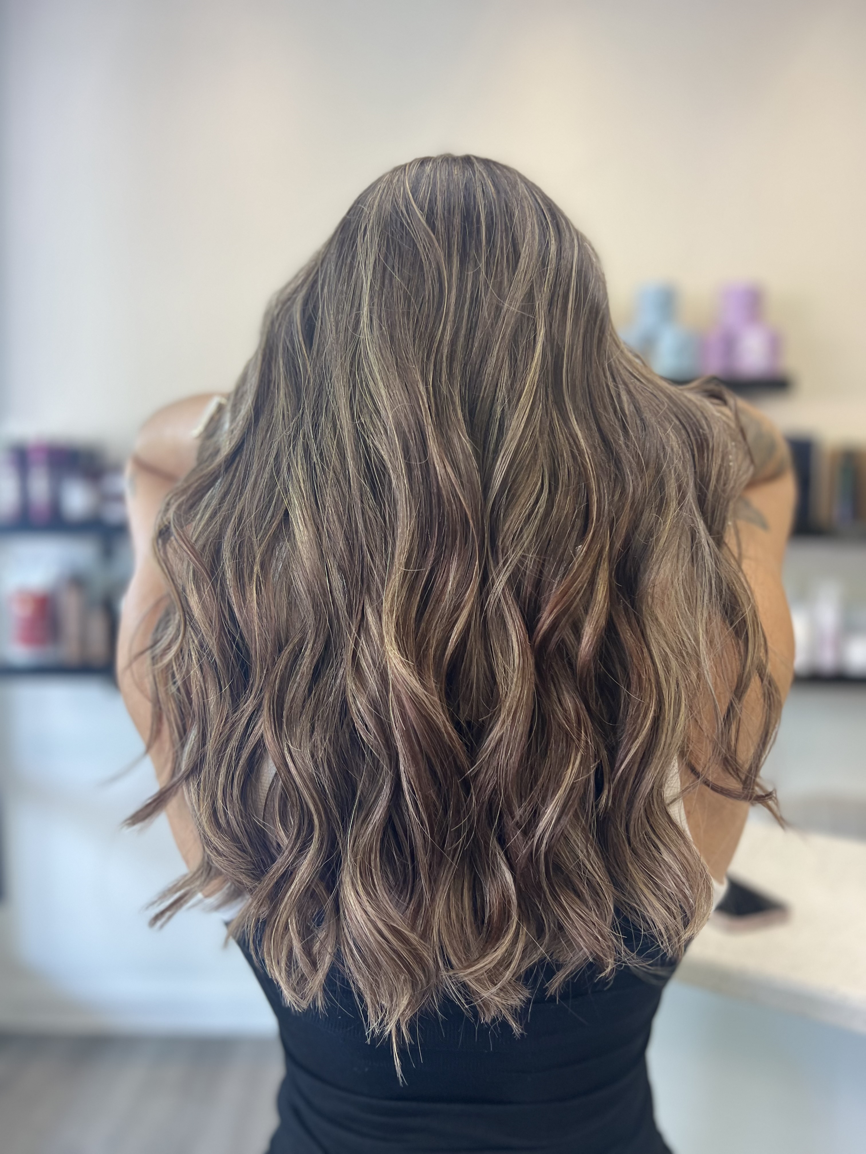 Dark brunette with subtle highlights and beautiful waves, back view